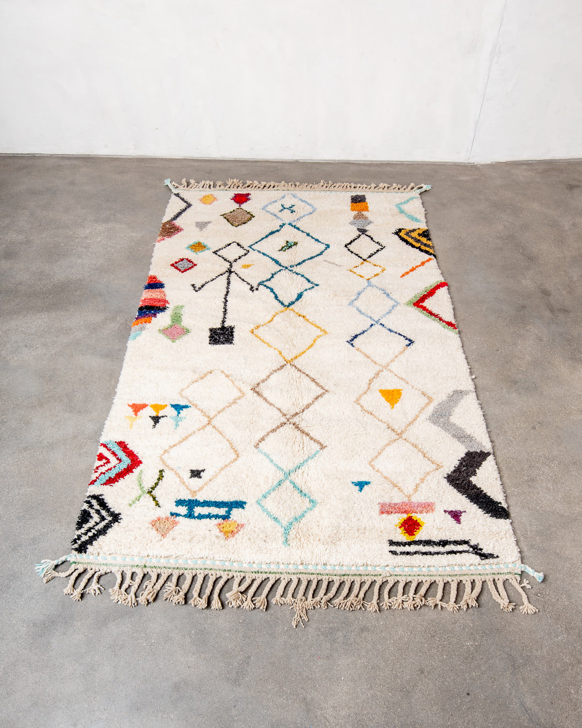 Modern, designer, handcrafted Berber runner rug from Morocco. Beniourain carpet with beautiful colours and patterns and fluffy wool texture.